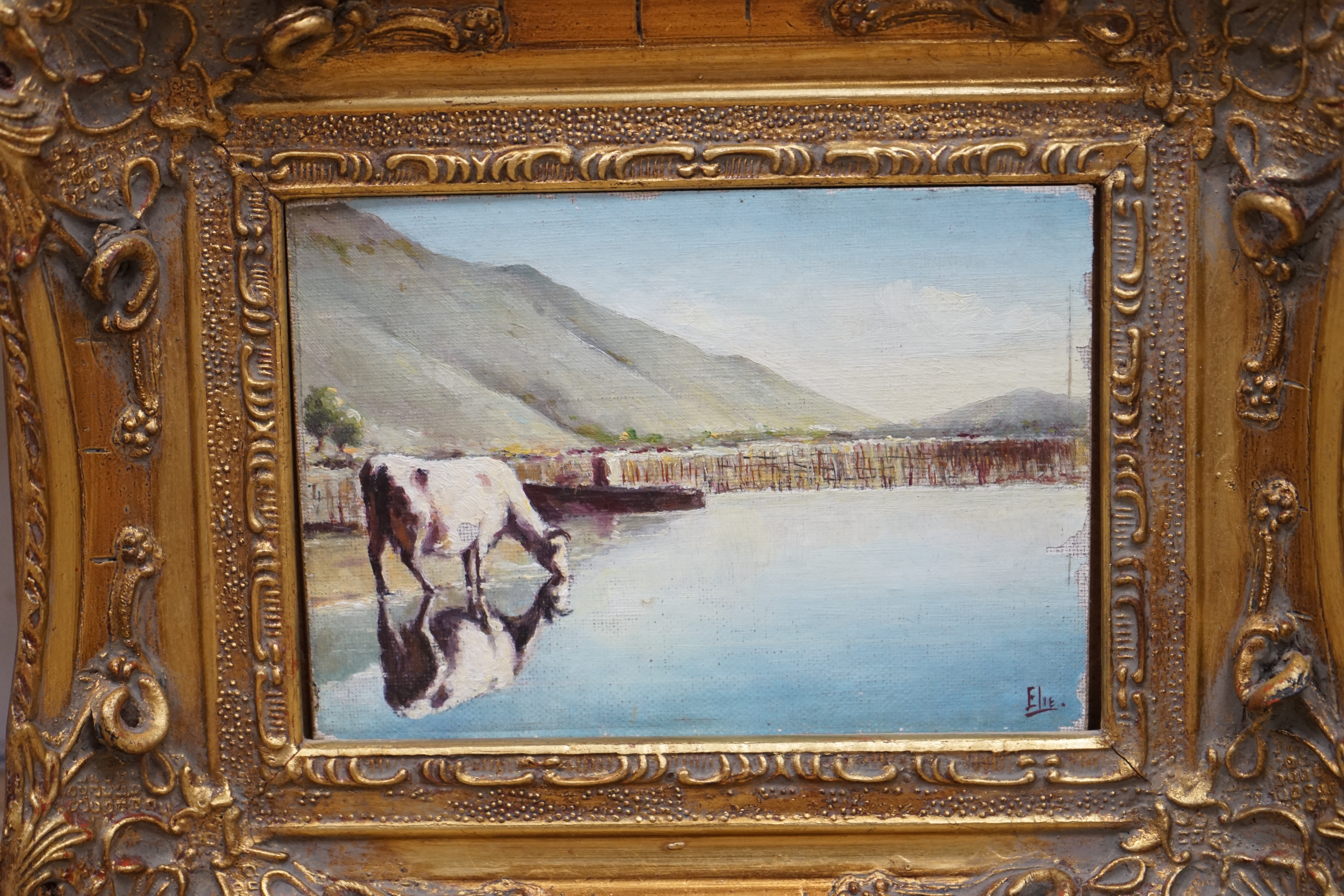Two decorative oils on board, Flock of sheep before a landscape and Riverscape with cattle, largest 24 x 19cm, each gilt framed. Condition - fair